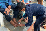 Students Perform Pada Pooja to Their Parents